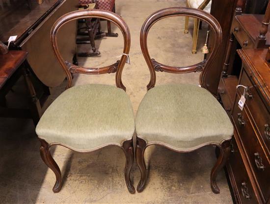 A part set of five Victorian mahogany balloon back dining chairs